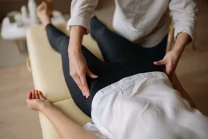 therapist evaluating a patient's body