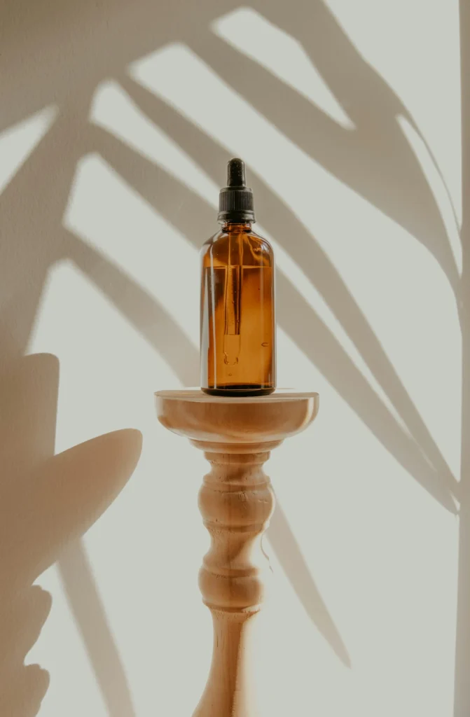 a bottle of massage oil on a side table